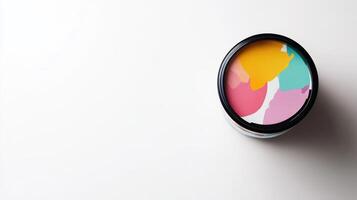 Colorful Paint Swirls in a Black Container photo