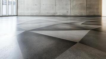 A large room with a concrete floor and a large window photo