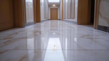A hallway with marble flooring and a light photo