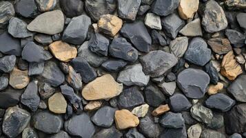 A Collection Of Dark Grey And Tan Stones photo