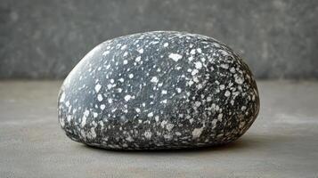 Smooth Dark Grey Stone with White Speckles photo