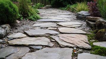 Stone Pathway Winding Through A Lush Garden Landscape photo