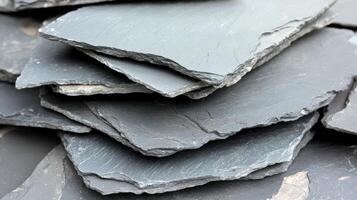 Stacked grey slate stone building material photo