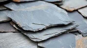 Stacked slate tiles showing texture and color variations photo