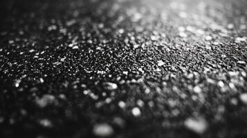 Abstract Black Surface with Glimmering Particles photo
