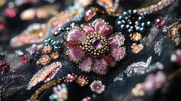 Intricate Beaded Embroidery on Black Mesh Fabric photo