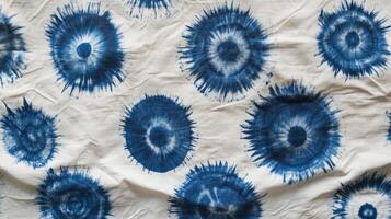 Indigo dyed fabric with circular sunburst patterns photo