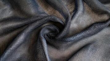 Draped dark gray fabric showing textured weave photo