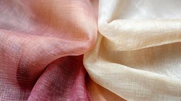 Draped ombre sheer fabric in shades of red and beige photo