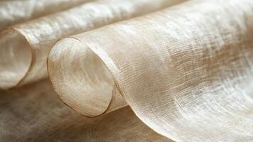 Rolled Beige Fabric Shows Intricate Woven Texture photo