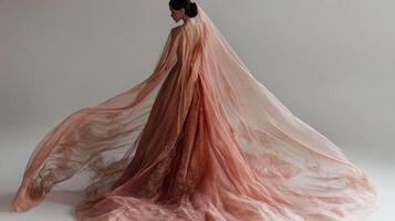 Elegant Woman In A Flowing Rose Gold Gown photo