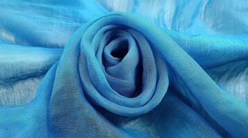 Blue fabric arranged in a rose like formation photo