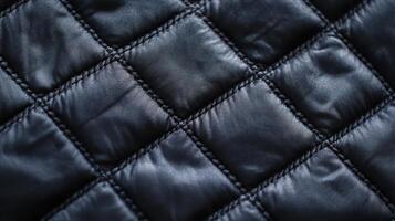 Dark quilted fabric texture close up detail photo