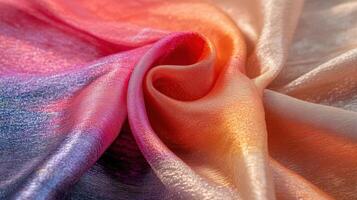 Draped iridescent fabric showcasing ombre color transitions photo