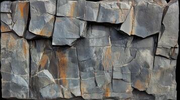 Gray and Brown Rock Face Texture Displaying Natural Fractures photo