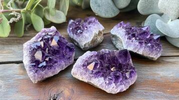 Amethyst Geode Clusters on Wooden Surface photo