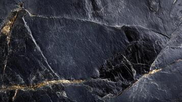 Dark Stone Texture With Gold Veins photo