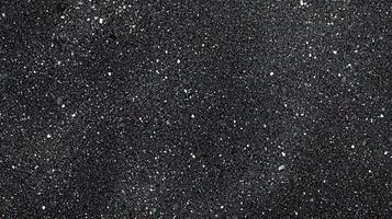 Black Glitter Background With Tiny Sparkling Particles photo