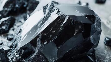 A Striking Black Crystal Formation Amidst Fragments photo