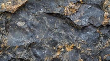 Dark Grey Rock Face With Gold Veins photo