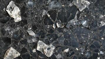 Black and white fragmented stone surface texture photo