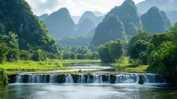 Serene Waterfall Cascading Through Lush Green Mountains photo
