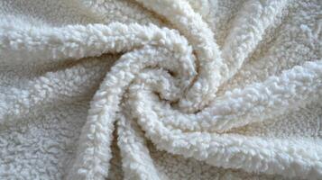 Soft White Fluffy Fabric Swirled in a Spiral Pattern photo