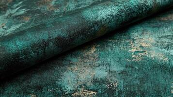 Teal Gold Fabric Roll Textured Surface photo