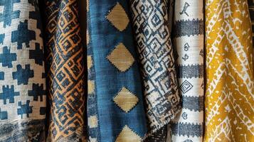 Rolled Rugs Displaying Diverse Geometric Patterns photo