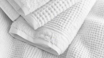 Soft White Towels Stacked Neatly Together photo