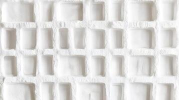 White textured surface with rectangular recesses photo