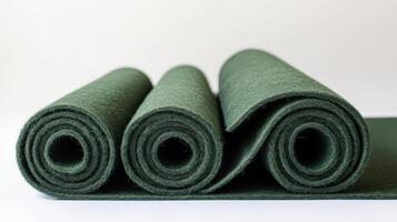 Rolled dark green felt fabric material rolls photo