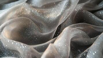 Silver Glitter Fabric Draped Softly Showing Texture photo