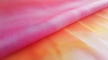 Ombre Fabric Draped in Soft Pink and Orange Hues photo