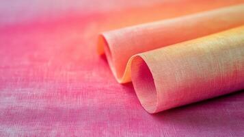 Pink and Orange Fabric Rolled in Soft Waves photo