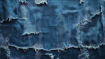 Ripped Blue Denim Fabric Texture Background photo