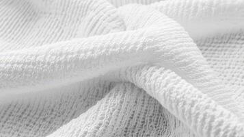 White Textured Fabric Draped in Soft Folds photo
