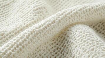 Cream Colored Knitted Fabric Texture Close Up photo