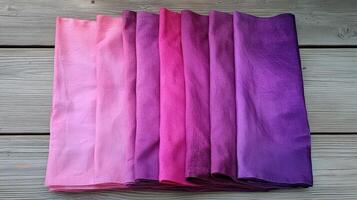 Gradient Dyed Fabric Samples Showcasing Pink and Purple Hues photo