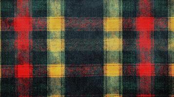 A plaid fabric with red, yellow and green colors photo