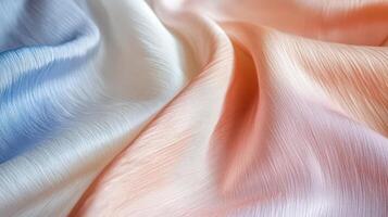 Soft pastel fabric draped in gentle waves photo