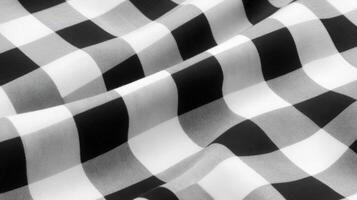 Black and white checkered fabric gently draped photo