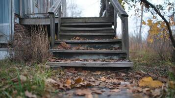 Old Wooden Steps Covered In Autumn Leaves photo