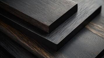 Stacked dark wood planks showing grain texture photo