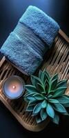 Microfiber towel resting on a wooden tray with a candle and plant photo