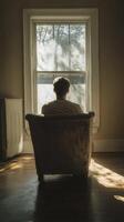 Emotional solitude in a sunlit room with a view photo
