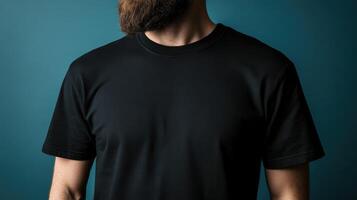 Man wearing a black t-shirt poses against a blue background photo