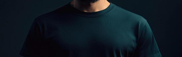 Dark background highlights a man wearing a black shirt photo