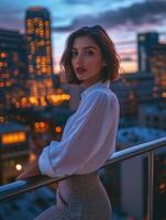 Woman gazes at city skyline during sunset with warm lights photo