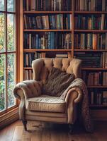 Cozy reading nook with armchair and bookshelves in warm sunlight photo